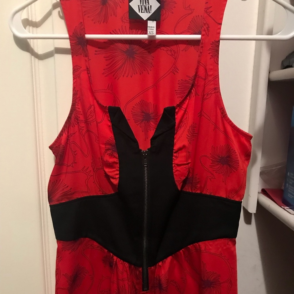 Patterned top with unique neckline and front zip
